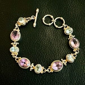 .925 Sterling silver Toggle bracelet with Amethyst and Aquamarine style stones.